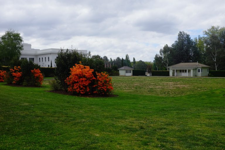 old parliament house of representatives garden with parliament building in background