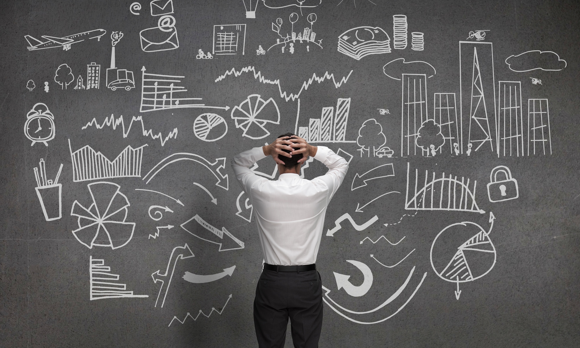man at blackboard with lots of choices