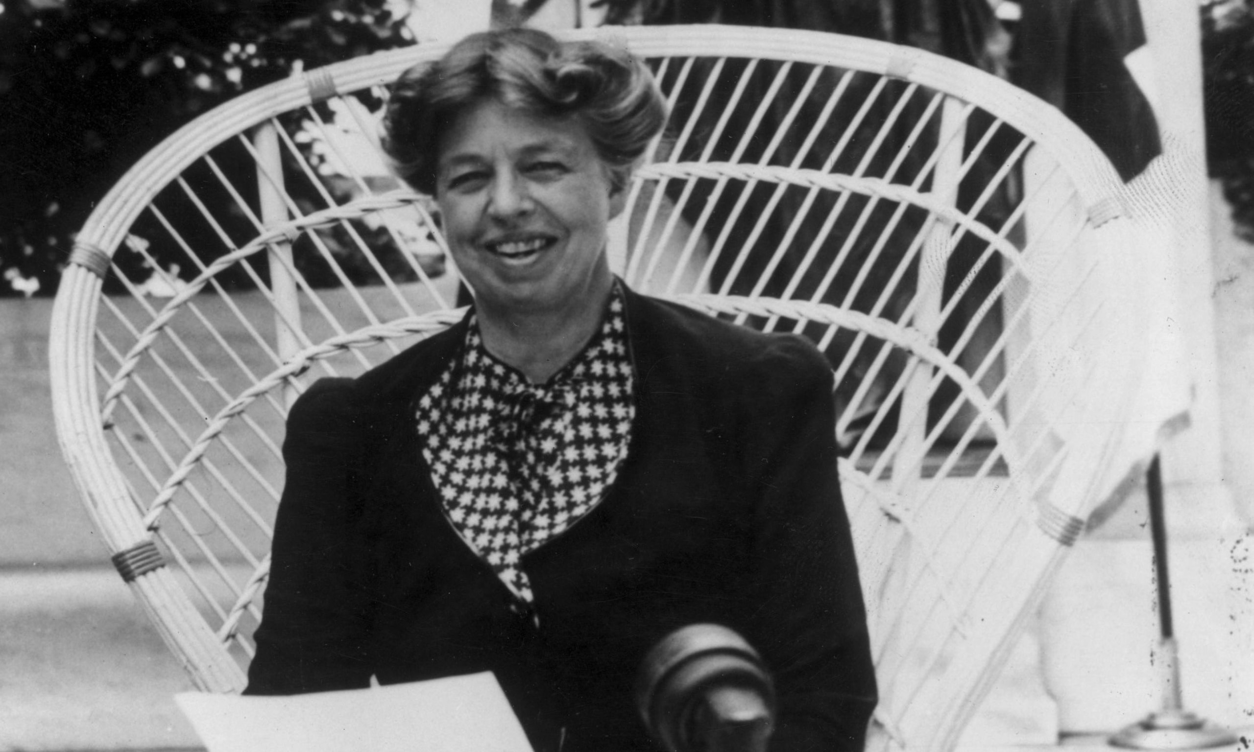 photo of eleanor Roosevelt sitting in a cane chair