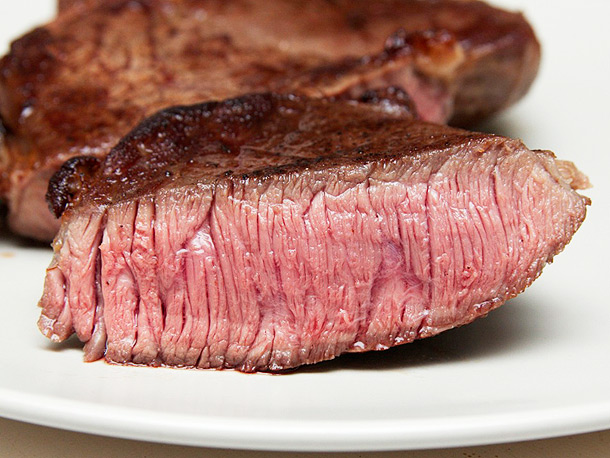 a piece of sous vide rump steak, cut to show inside
