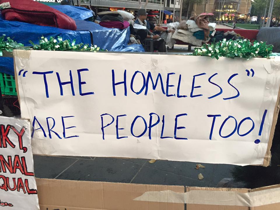 protest banner with the words the homeless are people too